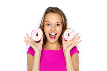 happy woman or teen girl with donuts