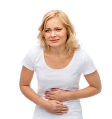 unhappy woman suffering from stomach ache