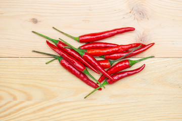 red chili pepper on wood background, spicy healthy herbal ingredient of Thai food.