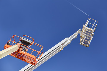 Construction Cranes aerial boom man lifts jet overhead