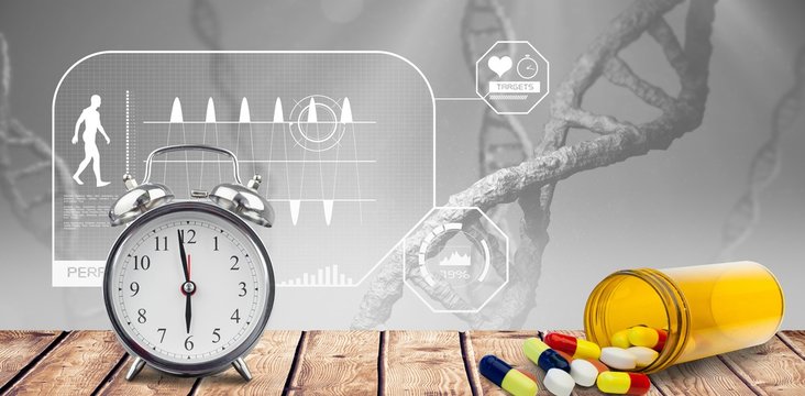 Alarm clock and pills put on a desk - Powered by Adobe
