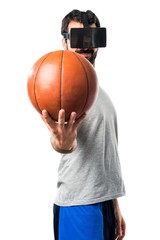 Man playing basketball using VR glasses