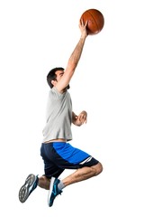 Man playing basketball jumping