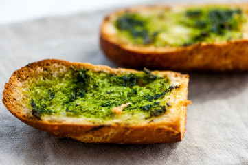 Garlic bread with wild garlic leaves