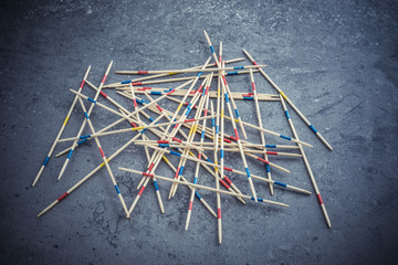 Mikado game wooden sticks on table. Concept of Fun game with strategy, a real mess or chaos. - obrazy, fototapety, plakaty
