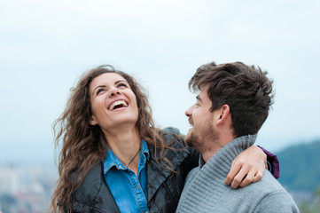 Fototapeta premium Pretty and inlove couple hugging, laughing and having a good time