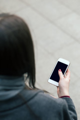 Close up of a woman using mobile smart phone