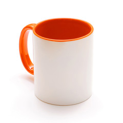 White mug with orange handle 