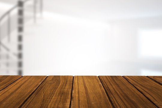 Composite image of high angle view of hardwood floor