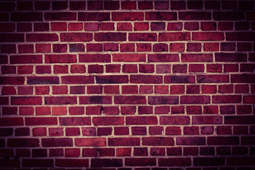 Fototapeta na wymiar Background of old vintage brick wall with vignette.