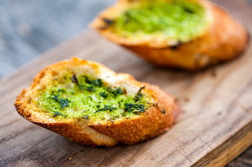Garlic bread with wild garlic leaves