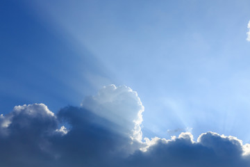 light rays of sun on clear blue sky background