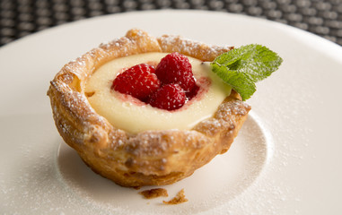Lemon curd tartlet with raspberry compote 

