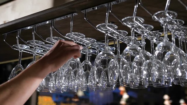 hanging wineglasses, selective focus, color reflections