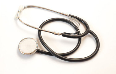 Fototapeta premium doctor's stethoscope on white background - medical, health and pharmacy abstract