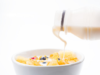 blueberry and milk on the white dish