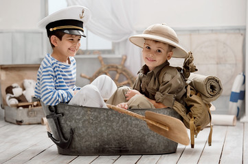 Boys playing captain and traveler