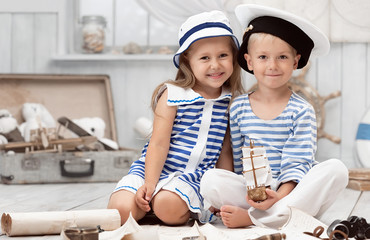 Children playing in the sailors in his room