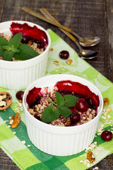 Homemade cherry crumble dessert in a rustic style.