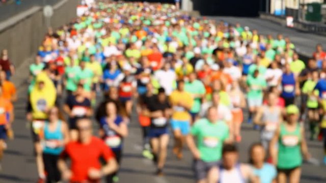 Blurred mass of marathon people runners