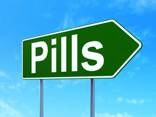 Medicine concept: Pills on road sign background