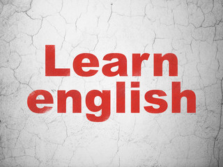 Obraz premium Studying concept: Learn English on wall background