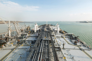 Oil product tanker during cargo operation. 
