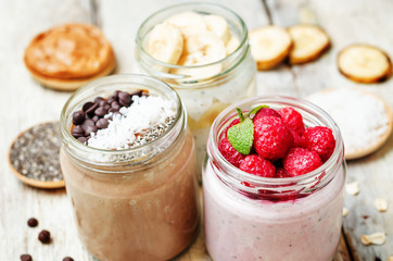 set overnight oats with berries, coconut, peanut butter, Chia se