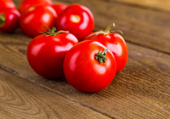 Tomatoes, cooked with herbs for the preservation on the old wood