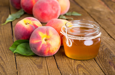 fresh peaches on wood background