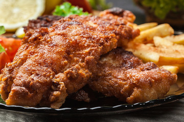 Fried fish in crispy batter with chips