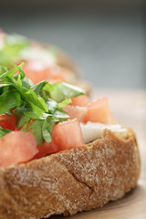 homemade bruschetta with cheese and vegetables, shallow focus