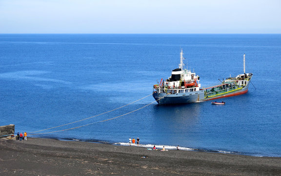 Cargo ship moored in front of Stromboli beach.