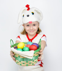 Girl in rabbit costume with a basket of Easter eggs