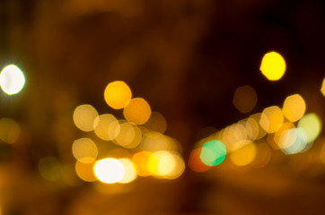 Blurry yellow evening lights as seen through abstract artistic point of view in traffic