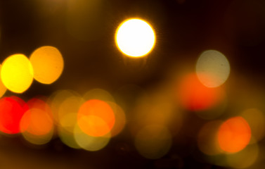 Blurry yellow evening lights as seen through abstract artistic point of view in traffic
