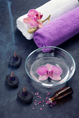 Spa, body care and aromatherapy. Orchid, zen stones and towels.