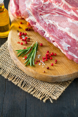 raw pork neck meat on wooden table