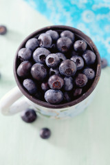 blueberry on wooden surface