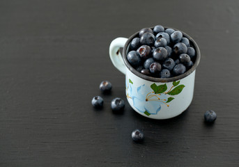 blueberry on wooden surface