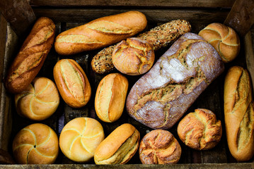 Different types of bread and rolls - obrazy, fototapety, plakaty