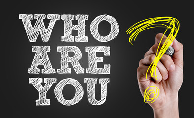 Hand writing the text: Who Are You?