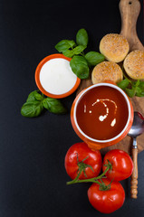 Fresh tomato cream- soup with green basil and bread