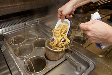 Chef is cooking pasta