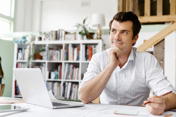 Naklejka premium Male architect in office