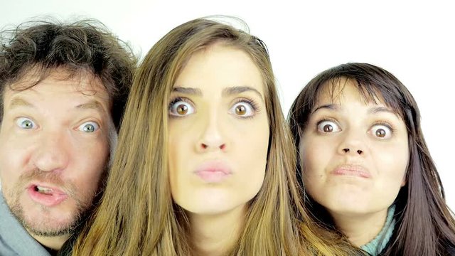 Beautiful people making funny crazy faces slow motion isolated