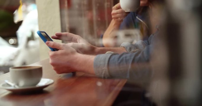 Man's hands holding Tablet in Coffee Shop