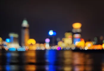 Foto op Plexiglas Background of night city skyline reflected in water © efired