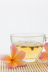 plumeria flower and  cup of tea