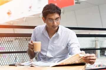 indian business male having milk tea